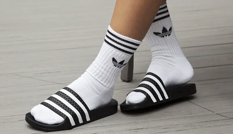 adidas slides on feet